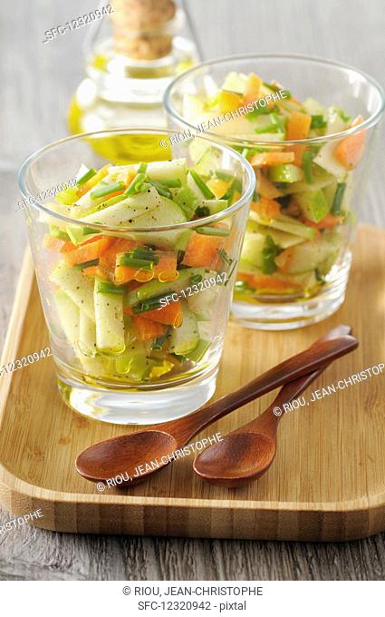 Carrot and apple salad in glasses with a curry and honey vinaigrette