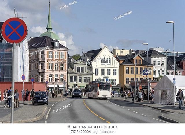 BERGEN, NORWAY - July 19 2019: touristic town cityscape with bus jammed in traffic at picturesque town center neighborhood