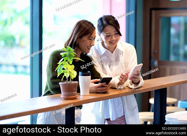Two women having meeting in café