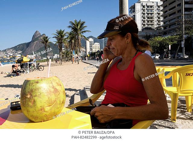 Jackie Silva, Brazil's first Olympic gold medallist in women's volleyball in Atlanta 1996, makes a phone call in front of her volleyball school at the beach of...