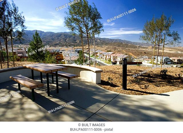 Picnic table overlooking contemporary housing community