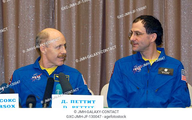 Astronauts Kenneth D. Bowersox (left), Expedition Six mission commander, and Donald R. Pettit, NASA ISS science officer, are pictured during a press conference...