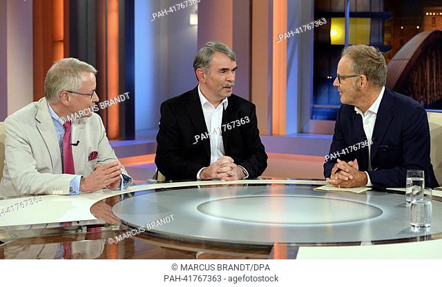 Gustl Mollath (L) sits next to his lawyer Gerhard Strate (L) and tv presentor Reinhold Beckmann during the taping of the show ""Beckmann"" in the television...