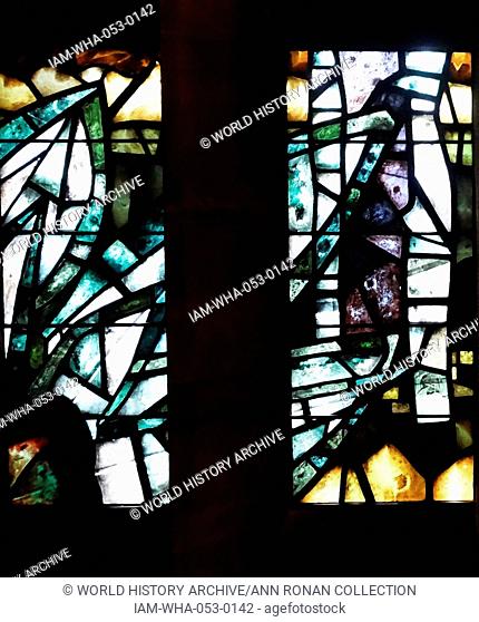 stained glass windows designed by john Piper depict the light of god, at the New St Michael's Cathedral, Coventry