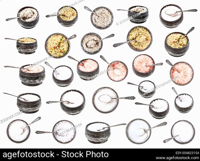 set from old vintage silver salt cellar with spoon with various salts isolated on white background