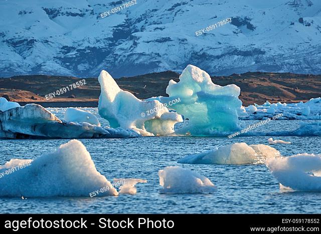 Glacial lake in Jokulsarlon landing between floating icebergs