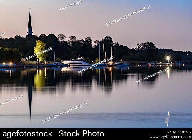 Stockholm, Sweden A midsummer midnight sun view over lake Malaren and the Ekero church. | usage worldwide. - STOCKHOLM/Sweden