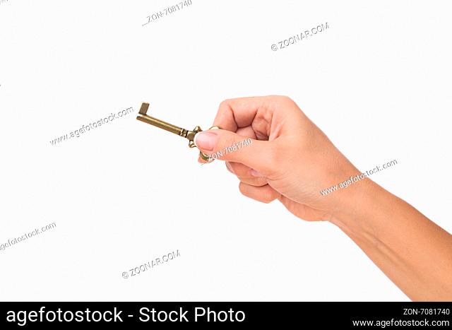 Raedy to open a door. Hand hold old key isolated on white