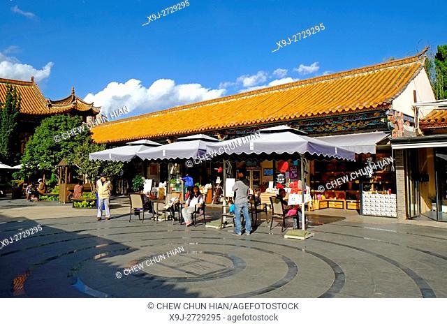 Tourist lounging in front of the souvenir shop near Cuihu Lake in Kunming, Yunnan, China