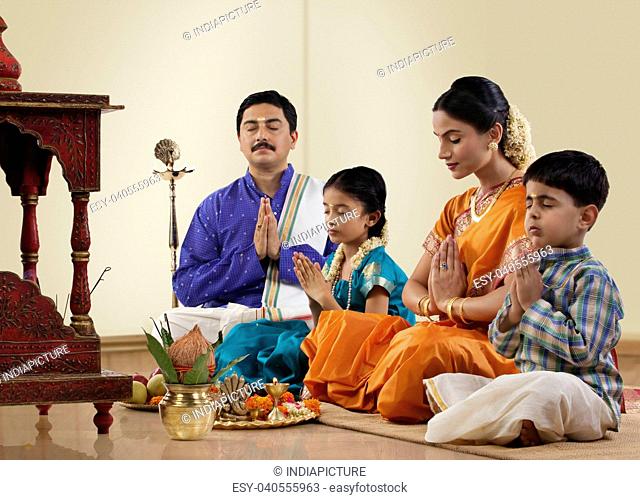 South Indian family praying