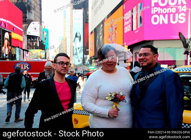 14 February 2023, USA, New York: Kristen LaBoy and Jesus Torres with fashion designer Christian Siriano after their Valentine's Day wedding in New York's Times...