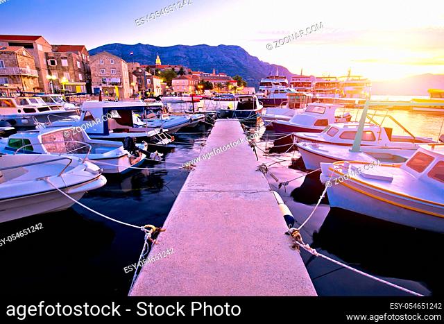 Town of Korcula coastline and harbor colorful sunset view, island in archipelago of southern Croatia
