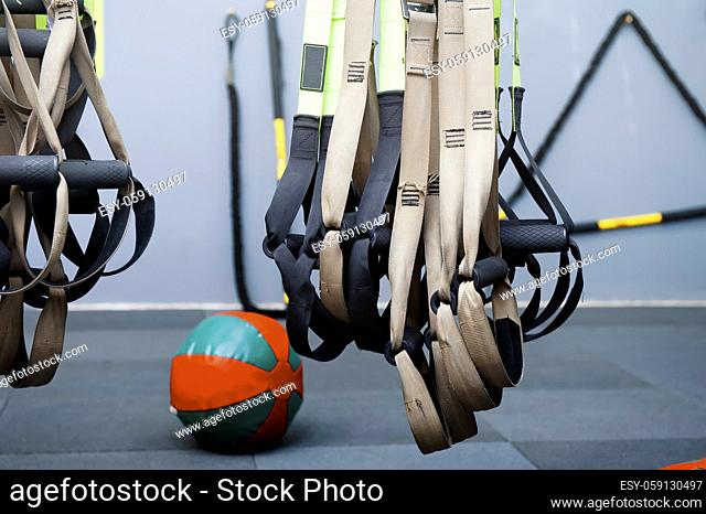Different sizes of kettlebells weights lying on gym floor. Equipment commonly used for crossfit training at fitness club