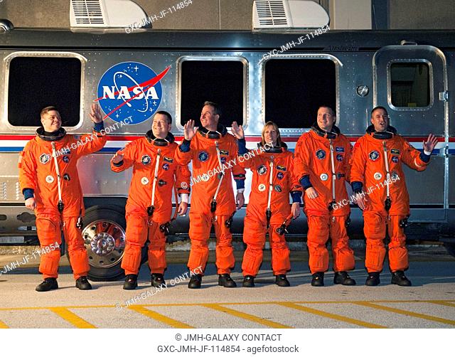 After suiting up, the STS-130 crew members pause alongside the Astrovan to wave farewell to onlookers before heading for launch pad 39A for the launch of space...