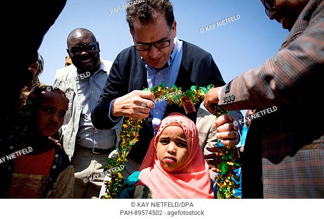 German Minister of Economic Cooperation and Development, Gerd Mueller is welcomed by residents in Kebri Dahar in the famine- and drought-plagued Somali region