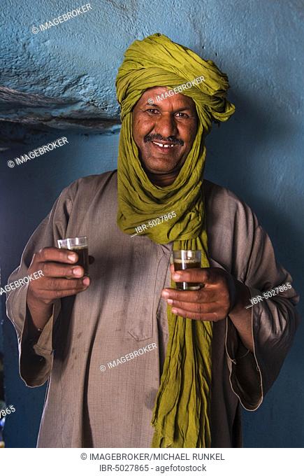 Tuareg man serving tea in his house, Assekrem, Tamanrasset, Hoggar mountains, Algeria, Africa