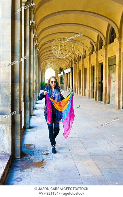 Caucasian female model poses for pictures at the tourists destination Barcelona, Spain. Barcelona is known as an Artistic city located in the east coast of...