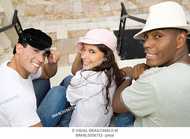 Hispanic friends wearing hats