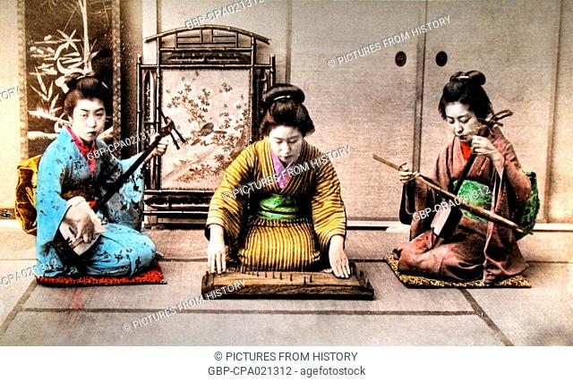 Japan: Three female sankyoku musicians playing samisen (left), yokin (centre) and kokin (right). Hand-coloured albumen print c. 1900