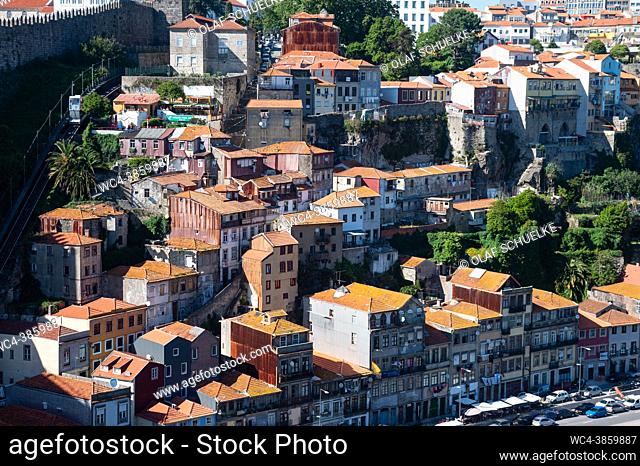 Porto, Portugal, Europe - Cityscape with the historic old town of the Ribeira district and traditional buildings on the hillside along the riverfront promenade...