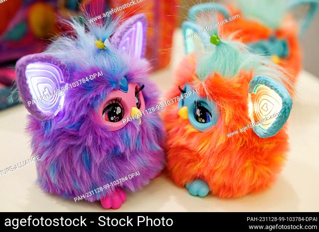 28 November 2023, Bavaria, Nuremberg: The Furby plush figures from Hasbro, an electronic furry animal, pictured on a table at the annual press conference of the...