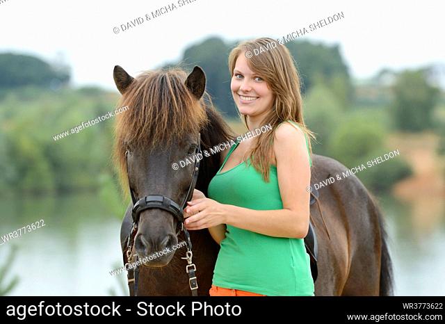 Young woman with an icelandic horse, Franconia, Bavaria, Germany, Europe