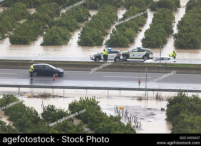 Alberic, Valencia, Spain, January 21, 2020. Police and Guardia Civil controlling the traffic of vehicles on the A7 flooded by the overflow of the river Jucar...