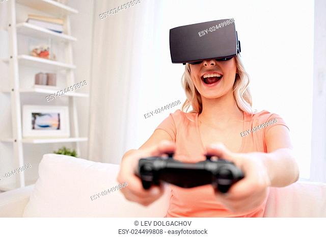3d technology, virtual reality, gaming, entertainment and people concept - happy young woman with virtual reality headset or 3d glasses playing video game with...