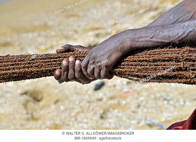 Fisherman pulling in a net on a beach in Galle, Sri Lanka, Ceylon, South Asia, Asia