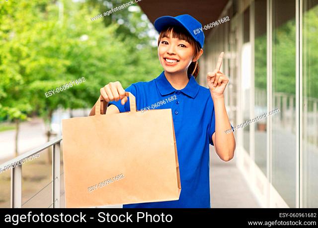 delivery woman with takeaway food in paper bag
