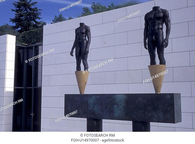 Switzerland, Lausanne, Ouchy, Olympic Museum, Vaud, Statue of a man and woman outside the Musee Olympique in Lausanne, Headquarters of the International Olympic...