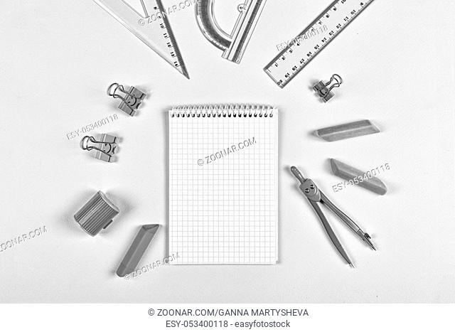 black and white. concept school. minimalism. Open school notebook and school chancery on a blue background. copy space. mock up