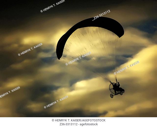Paraglider over cloudy sky, Poland