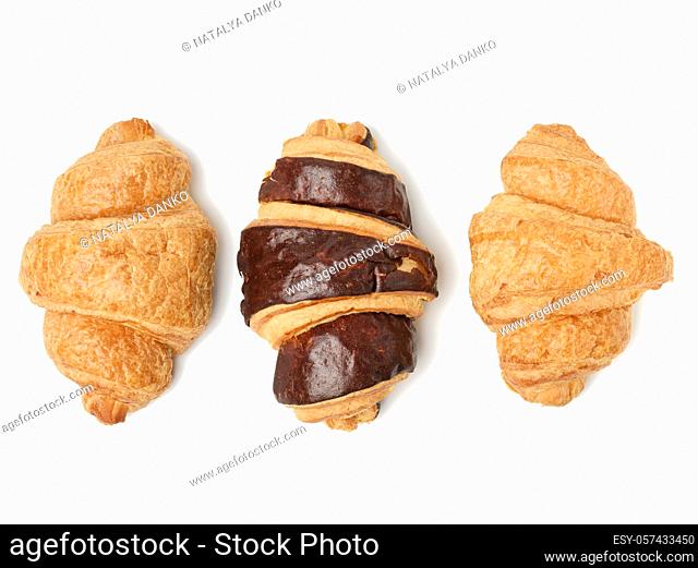 baked chocolate croissant made from white wheat flour isolated on white background, top view