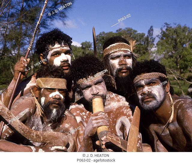 Australia. Cairns. Tjapukai dance group aborigines blowing didgeridoo