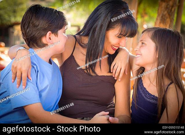 Attractive Family Portrait in a Rustic Ranch Setting at the Pumpkin Patch.