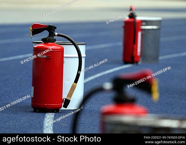 20 May 2023, Berlin: Soccer: Bundesliga, Hertha BSC - VfL Bochum, 33rd matchday, Olympiastadion, fire extinguishers are ready in front of the visitors' curve on...