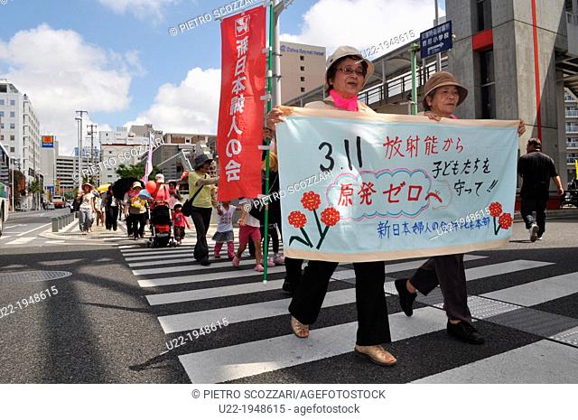 Naha, Okinawa, Japan, women parading along Kokusai-dori during the second anniversary of Fukushima’s disaster