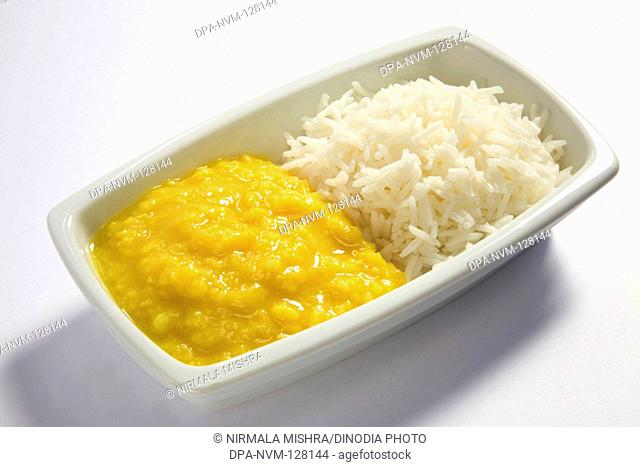Vegetarian , Indian cuisine dal bhath boil basmati rice bhath chaval oryza sativa and moong dal mung beans phaseolus aureus served in plate