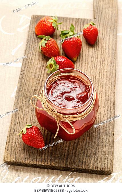 Jar of strawberry jam. Party dessert