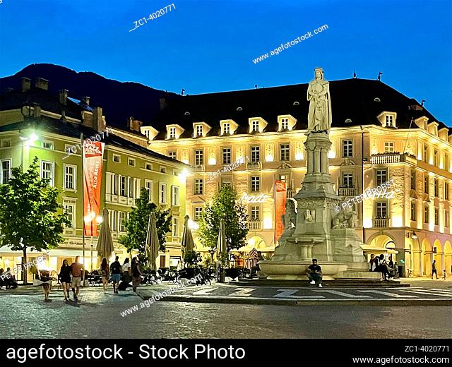 Walther Square in Bolzano in South Tyrol. with Monument to the poet Walther von der Vogelweide in the evening - Italy