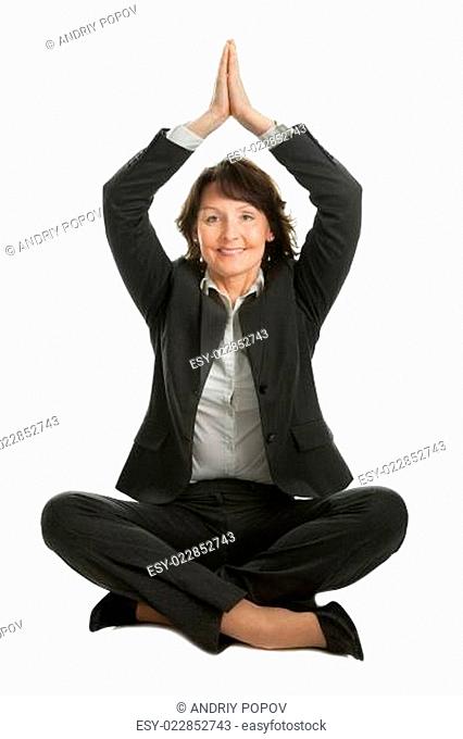 Businesswoman sitting in lotus position