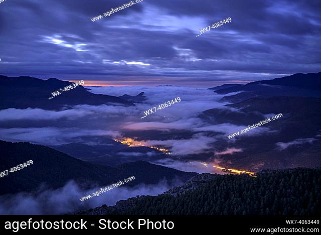 Sunrise with fog and clouds, seen from the Devesa viewpoint in Coll de Pal (Barcelona province, Catalonia, Spain, Pyrenees)