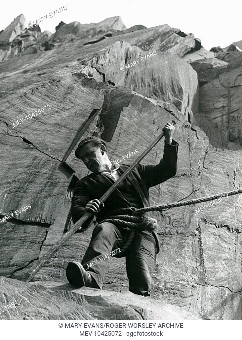 A man at work, 150 feet up on the main face of Dinorwig (or Dinorwic) Slate Quarry, near Llanberis, North Wales