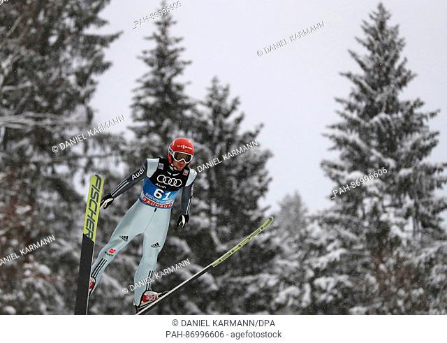 Germany's Markus Eisenbichler jumps during the qualification from the Paul Ausserleitner ski jump at the Four Hills Tournament in Nordic skiing/ski jumping in...