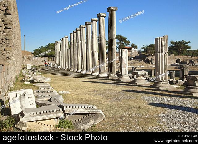 Tourists walking in front of the marble columns of ancient medicinal sanctuary of Asklepion near Bergama Town, Izmir Province, Aegean Region, Turkey, Europe