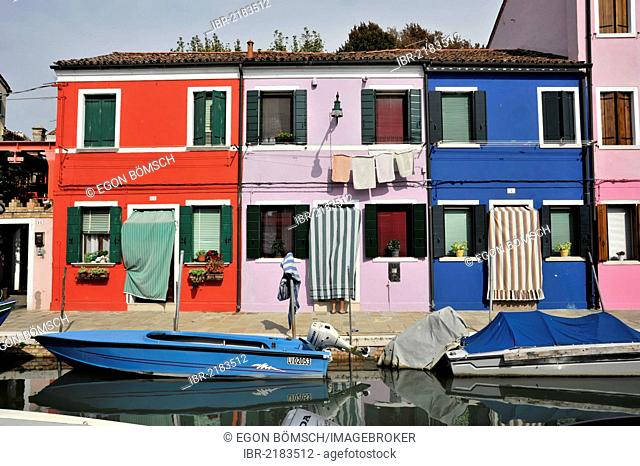 Colourful painted houses, boats in the canal of Burano, Burano Island in the lagoon of Venice, Italy, Europe