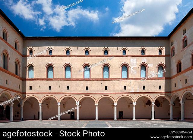 View from internal court to walls and arcades of ancient medieval fortress Rocchetta inside the Sforza castle. Milan, ITALY - July 7, 2020