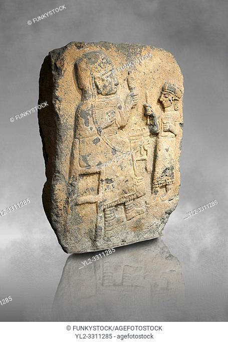 Hittite monumental relief sculpture. Late Hittite Period - 900-700 BC. Adana Archaeology Museum, Turkey. Against a grey art background