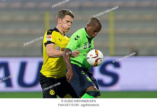 Dortmund's Matthias Ginter (l) and Jeonbuk's Luiz Henrique (r) in action during the test match between Jeonbuk Hyundai Motors FC vs